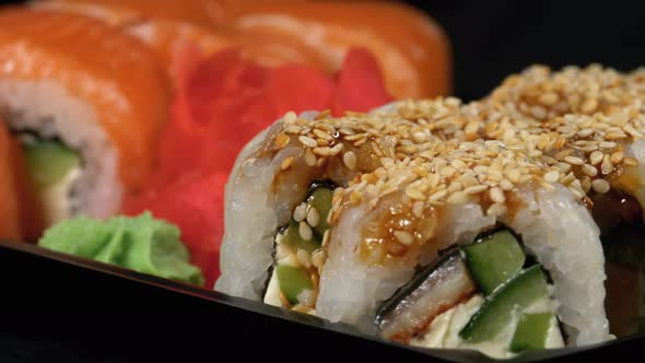 Sushi Rotates on Plastic Box. Japanese Sushi Roll Set Philadelphia, California alt