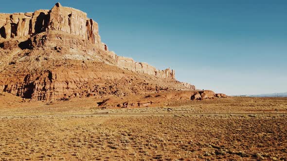 Drone Flying Over Sandstone Desert Towards Huge Rocky Mountain In American National Park Vast Dry By Vadim Key