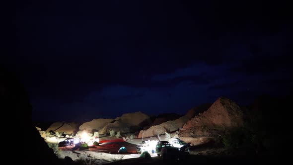 Base Camp of Tourists on Offroad Vehicles in the Desert in the Evening Time Lapse