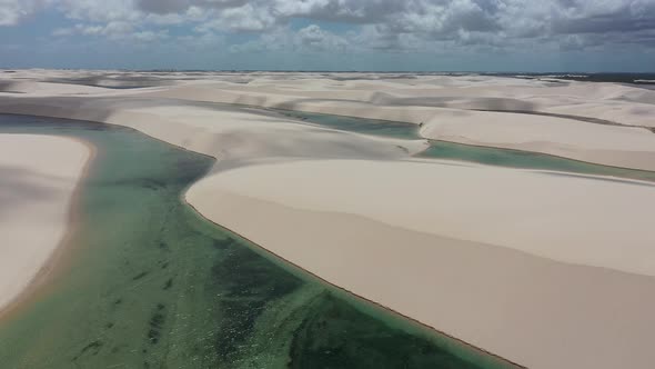 Sand dunes mountains and rain water lagoons at northeast brazilian paradise. alt
