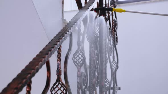 Close Up of Man in Hazmat Suit Spraying Chemical alt
