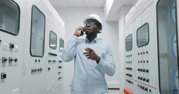 A Production Engineer is Talking on the Phone alt