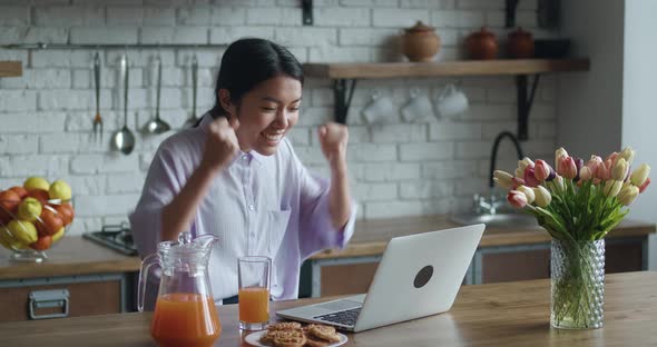 Pretty Asian Woman Read Email on Laptop Cant Believe in Luck Looking Excited Surprised Feels Very alt