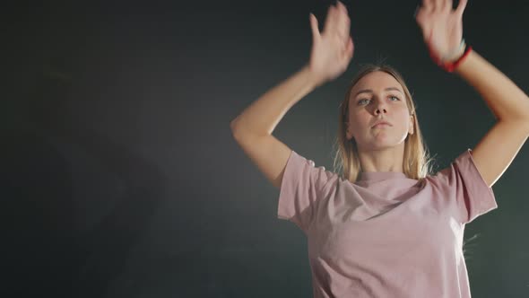 Slow Motion of Creative Flexible Girl Dancing Moving Arms in Dark Dancehall alt