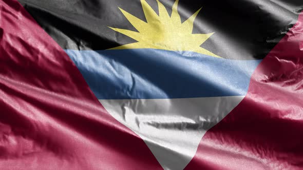 Antigua and Barbada textile flag waving on the wind. 10 seconds loop.  alt