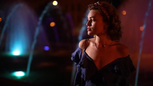 Beautiful Woman Fashion Model Posing at Night