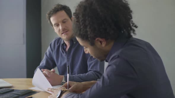 Man signing document alt
