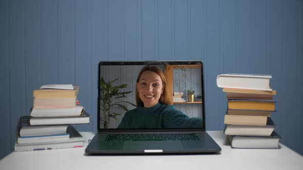 A Young Woman is Talking Through a Video Call