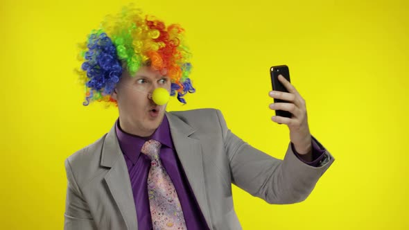 Clown Businessman Entrepreneur Boss in Wig Making Selfies Using Smartphone alt