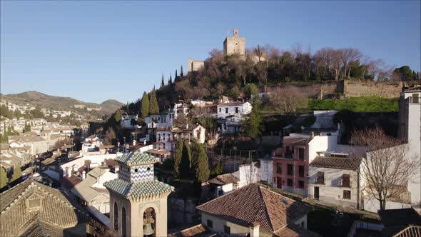 Aerial riser reveals iconic Alhambra palace complex on Sabika hill, Granada