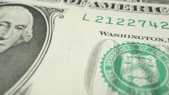 Panning over 1 dollar USD bill up close alt
