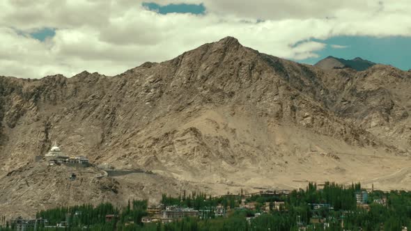 the leh city with house made of mud and local materials crowded the Buddhist flag fluttering due to alt