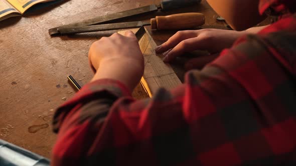 Lefthanded Boy Working with a Clerical Knife alt