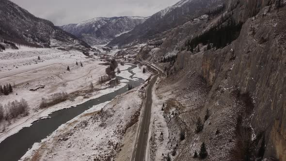Flying Over Chuikskiy Trakt Road in a Valley Among Rocky Mountains