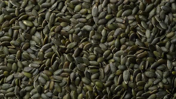 pumpkin seeds top view, rotate. 4K UHD video alt