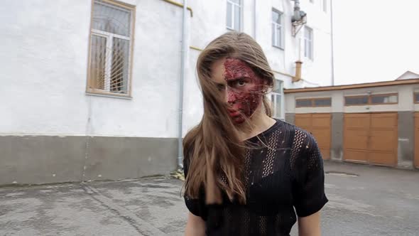 Girl in blood at night on Halloween, zombie girl alt