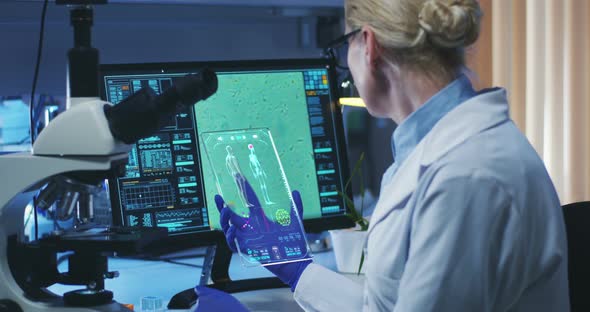 Biologist Using Holographic Display Screen alt