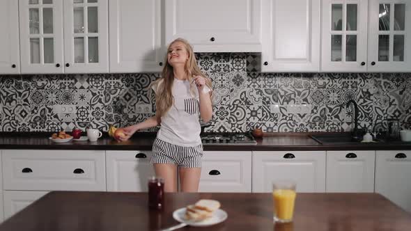 Happy Girl Dancing In Kitchen Stock Footage VideoHive   Inline Image Preview 