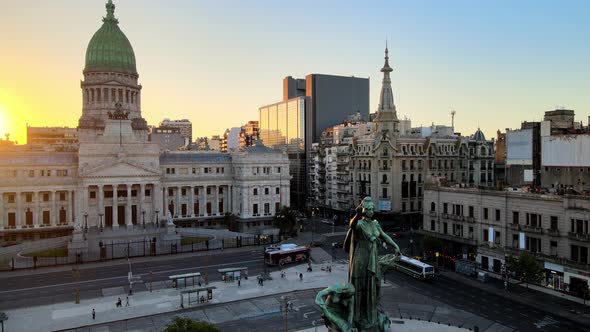 Pedestal shot of two congresses monument in the foreground at congressional plaza with Palace of the alt