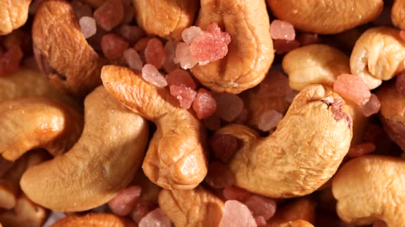 Video of cashews nut and Himalayan pink salt rotates slowly alt