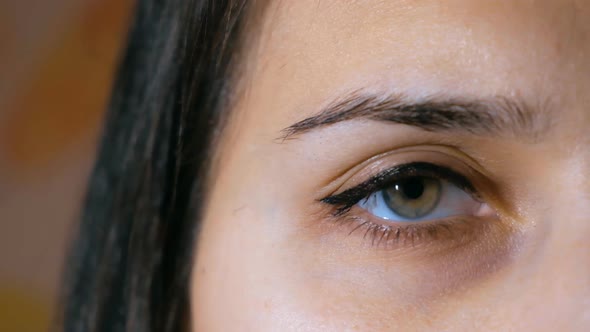Close-up of a Woman Opens Her Eye alt