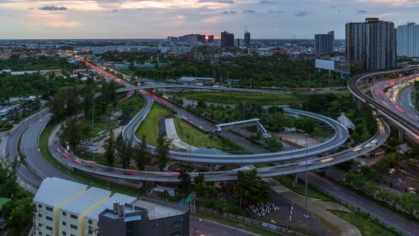 Highway interchange junction and traffic during rush hour at Bangkok, in evening - time lapse