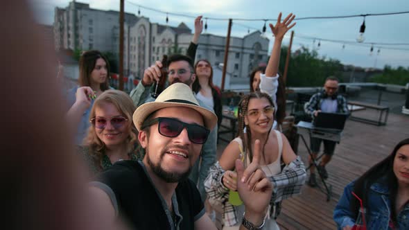 Overjoyed Hipster People Posing POV Selfie Dancing at Roof Night Party Together Positive Emotion alt
