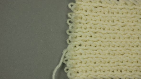 Dissolving Knitted Background. Place for Text. Stop Motion alt