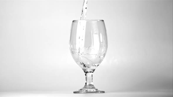 Super Slow Motion in the Glass Whirlpool Pours Water alt