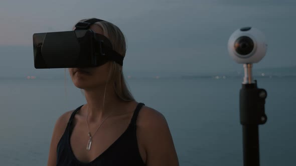 360 Degree Camera and Woman with VR Glasses alt