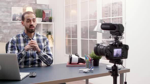 Young Influencer Recording a Podcast Using Modern Technology alt