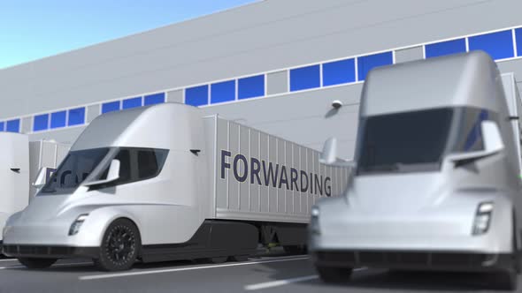 Trucks with FORWARDING Text Being Loaded or Unloaded at Warehouse alt
