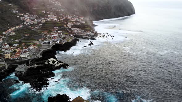 Aerial Unveil Shot of Porto Moniz Town, Madeira Island, Portugal alt