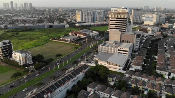 Aerial view of a small city with green areas