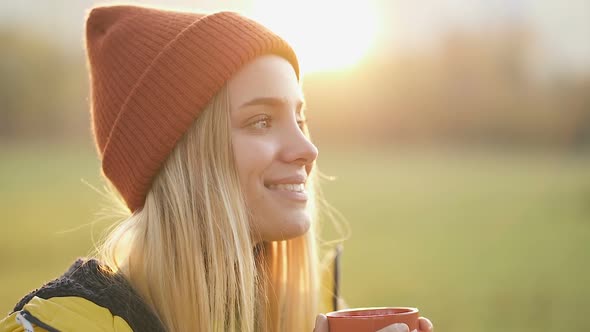  Portrait of attractive blonde woman drinking coffee