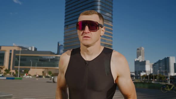 Pro Runner on a City Road Athlete Trains in an Urban Environment on a Sunny Day Modern Urban alt