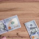 Person counts hundred dollar bills by throwing them table, finance and business. - VideoHive Item for Sale