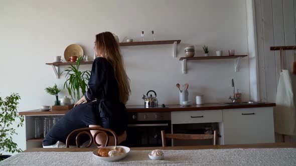 Loving Man Is Grabbing His Wife and Carrying Out From Kitchen, Cheerful Couple at Morning alt
