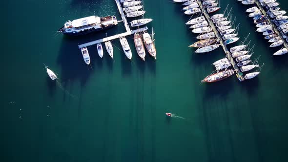 View from drone on full of yachts Bodrum harbour and ancient Kalesi castle in Mugla in Turkey alt