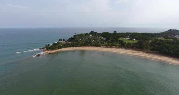 Aerial shot of the coastline and horizon of Mermaids Bay in the Southwest Africa San Pedro Ivory Coa alt
