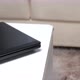 a black laptop on a white table - VideoHive Item for Sale