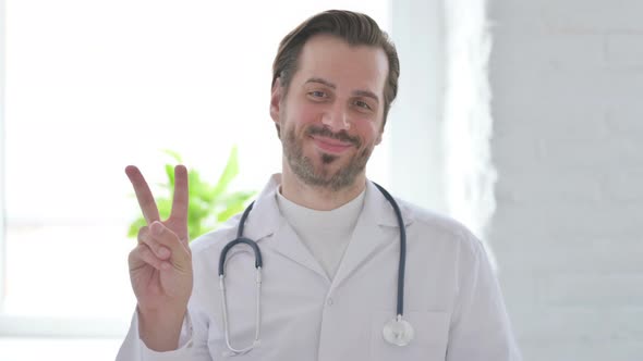 Portrait of Young Doctor Showing Ok Sign with Finger alt
