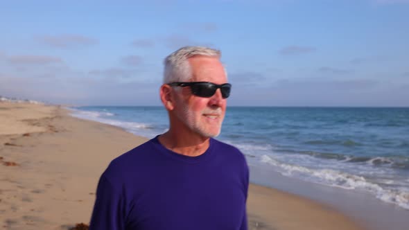 Mature Man Exercising At The Beach alt