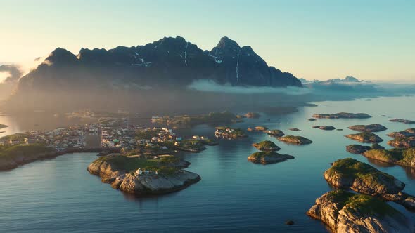 Flight over the sea and view on the fishing village Henningsvaer ,Lofoten Islands,Norway