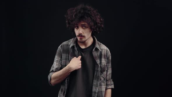 The Curly Charismatic Confused Young Man Looks at Him Grimaces and Says No No No I Don't alt