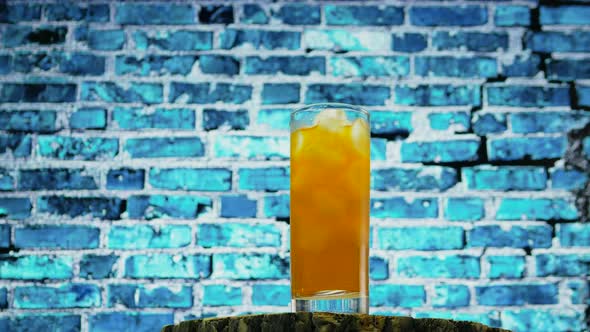 Summer Fresh Drink With Ice, Yellow Lemonade On The Background Of A Colorful Brick Wall. alt