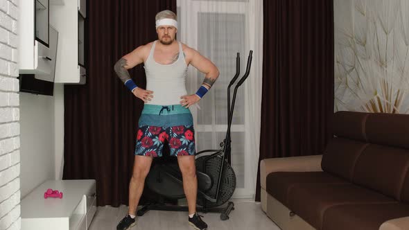 Funny Fat Sportsman Man Making Sport Fitness Exercise Showing Cardio Exercises for Weight Loss alt