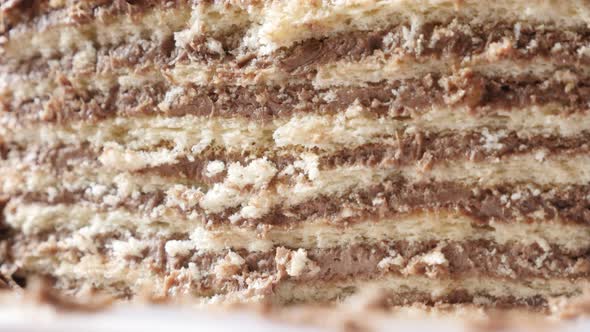 Slow tilt creamy layers of chocolate cake on the plate 4K 2160p 30fps UltraHD footage - Rich and tas alt