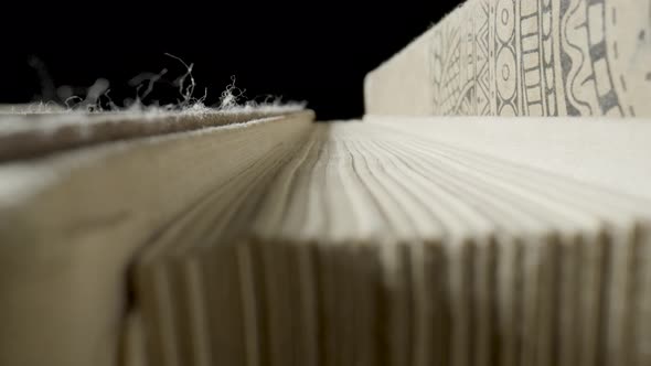 Macro of a Stack of Old Books with Gray Shabby Covers and Yellowed Pages alt
