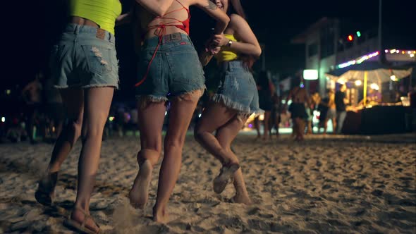 4K Group of Asian woman enjoy full moon beach party and dancing together. alt